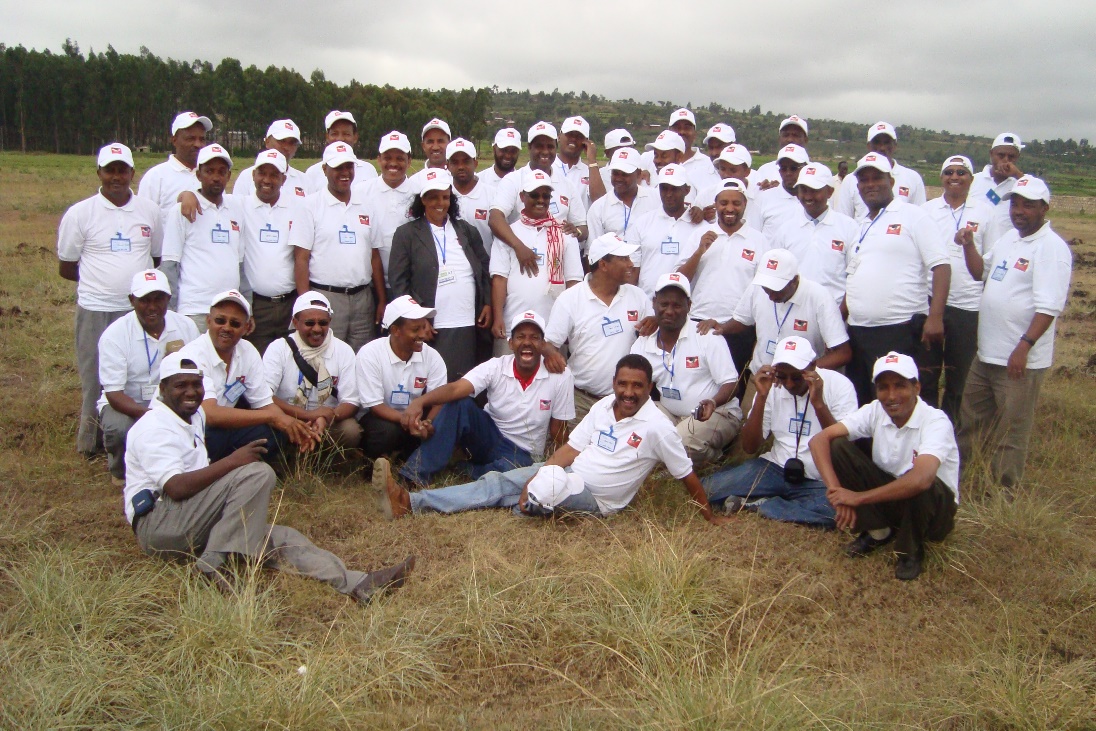 A group of people in white shirts

Description automatically generated