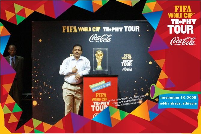 A person standing at a podium with a trophy

Description automatically generated